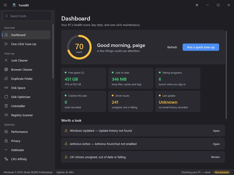 The TuneBit dashboard: a health score of 70 out of 100, free space, junk to clear, startup programs, crash count and driver issues, with a list of things worth a look.